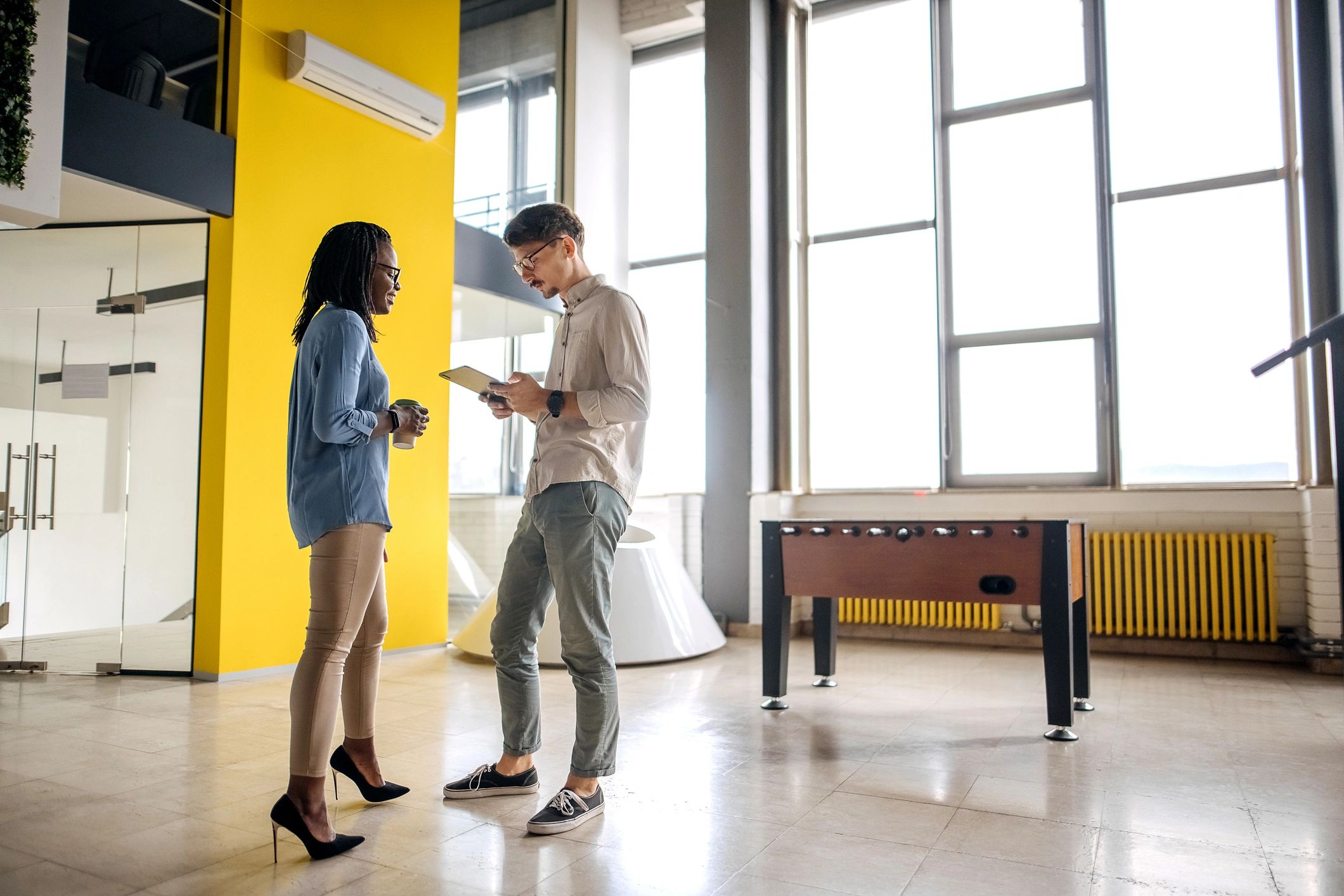 Consultant speaking with a client in an office