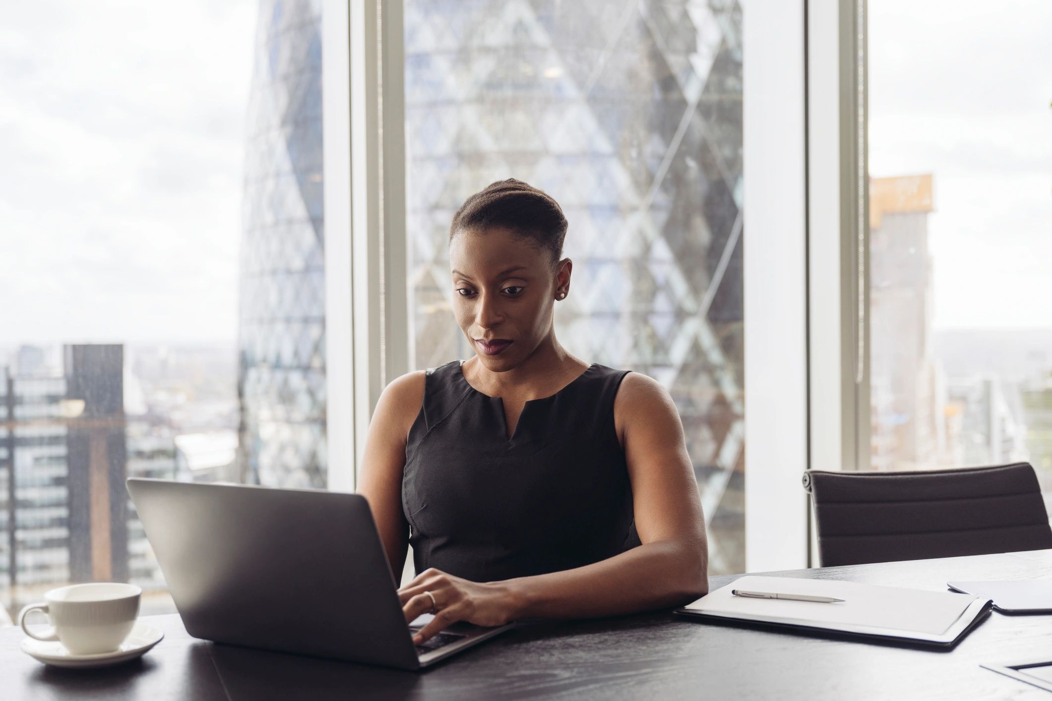 Professional consultant working with technology in a modern office