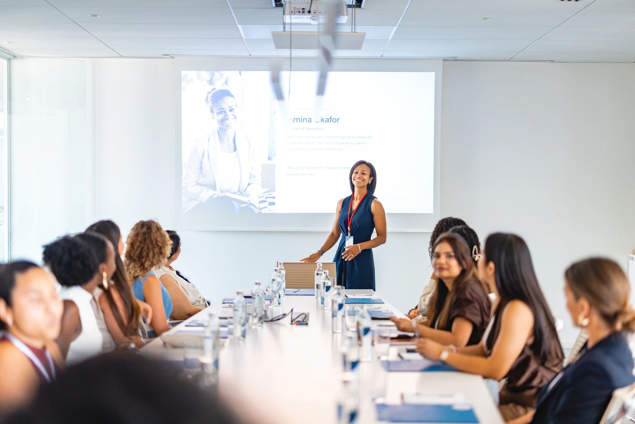 Speaker presenting to a business audience during a professional session